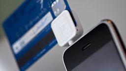Square, a credit card reader made for smartphones, is plugged into an Apple Inc. iPhone for a photograph in New York, U.S., on Monday, Oct. 25, 2010. Square Inc.'s mobile-payment technology allows smartphone users to make credit card payments and the availability of funding for new ventures. Photographer: Jin Lee/Bloomberg via Getty Images