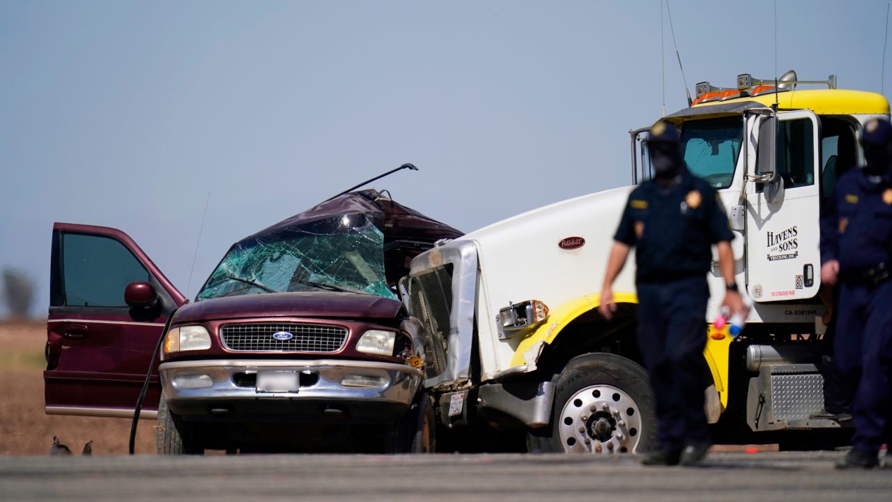 Law enforcement officers work at the scene of a deadly crash in California not far from the Mexican border. CNN has blurred a portion of this image.