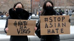 NEW YORK, NEW YORK - FEBRUARY 20: Protestors hold signs that read "hate is a virus" and "stop Asian hate" at the End The Violence Towards Asians rally in Washington Square Park on February 20, 2021 in New York City. Since the start of the coronavirus pandemic, violence towards Asian Americans has increased at a much higher rate than previous years. The New York City Police Department (NYPD) reported a 1,900% increase in anti-Asian hate crimes in 2020. (Photo by Dia Dipasupil/Getty Images)