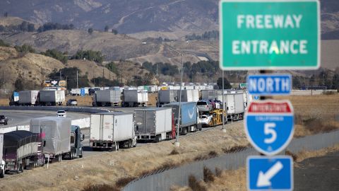 Vehicles back up on the northbound Interstate 5 as seen from the Hasley Canyon Road exit in Castaic on January 26, 2021. A series of winter storms in California closed several major highways, including parts of I-5.
