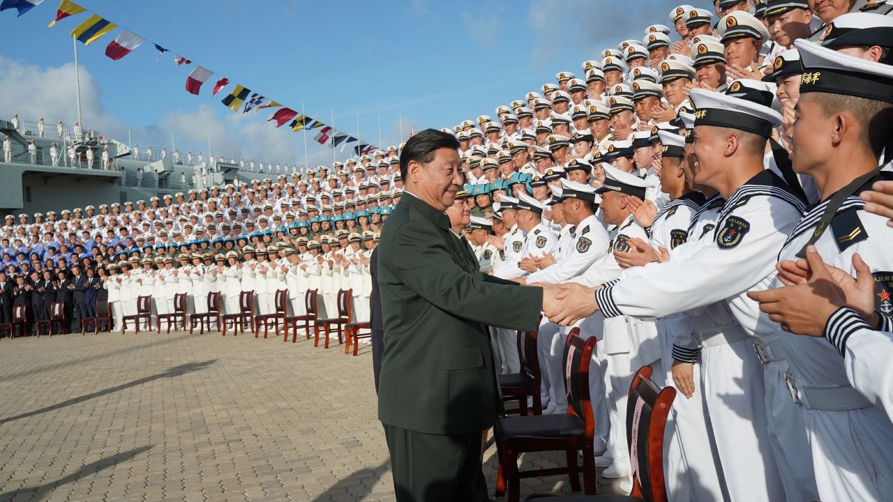 Chinese President Xi Jinping, meets with representatives of the aircraft carrier unit and the manufacturer at a naval port in Sanya, south China's Hainan province on Dec. 17, 2019.