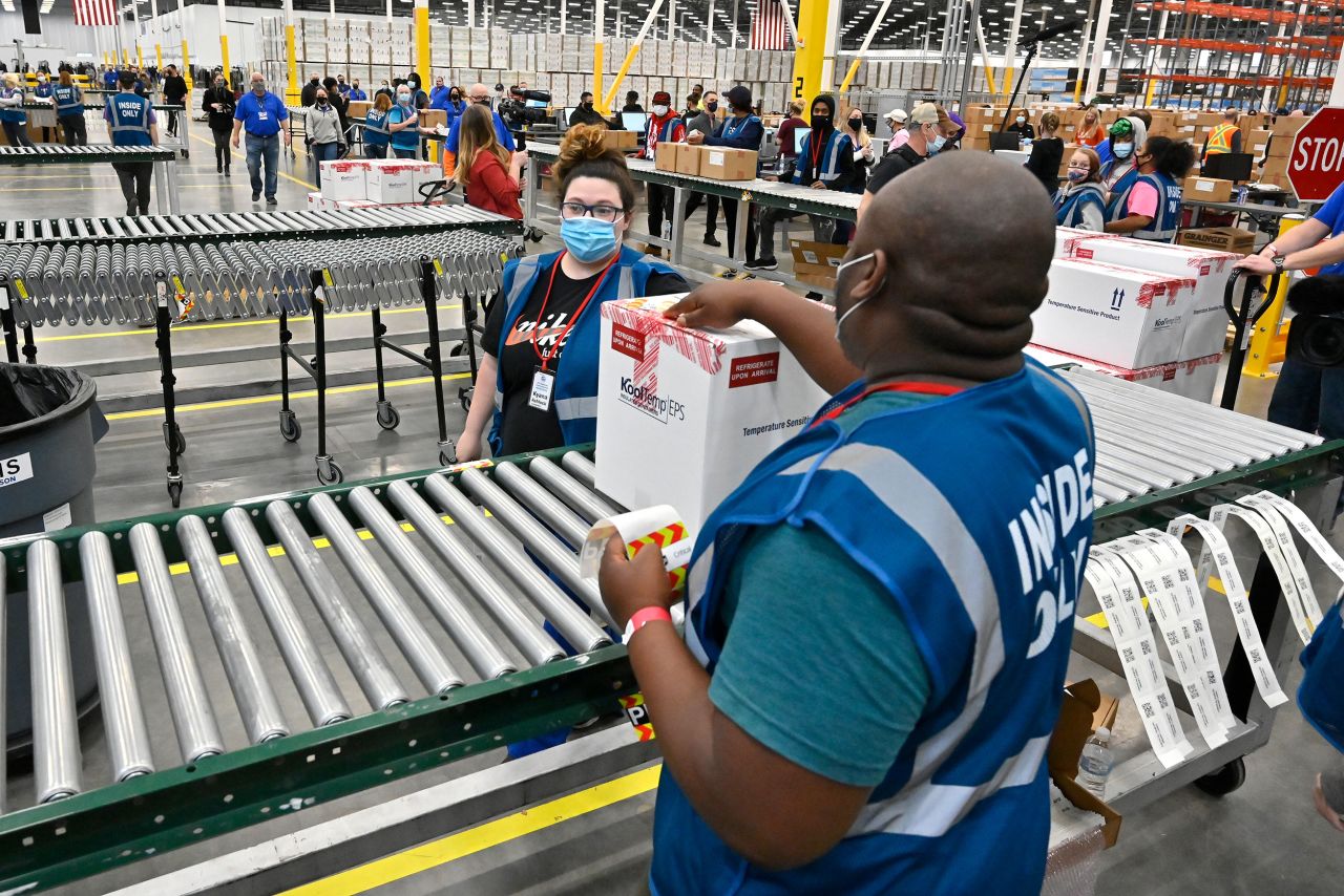 A box containing Johnson & Johnson's Covid-19 vaccine heads down the conveyor to an awaiting transport truck in Shepherdsville, Kentucky, on Monday, March 1. The US Food and Drug Administration <a href="https://www.cnn.com/2021/02/27/health/johnson-johnson-covid-19-vaccine-fda-eua/index.html" target="_blank">has given the vaccine emergency use authorization.</a>