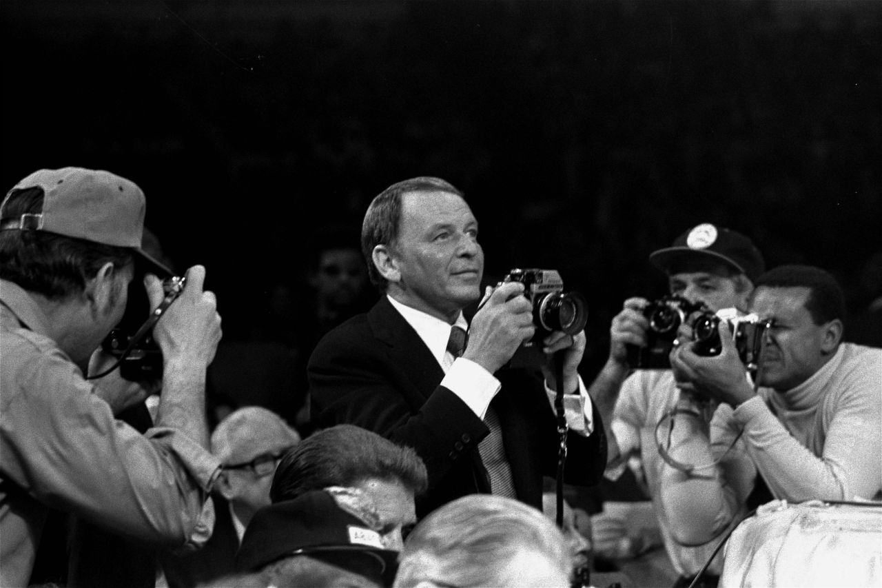 March 8, 1971 -- Film star Frank Sinatra photographed "The Fight of the Century" between Ali and Frazier for Life Magazine.