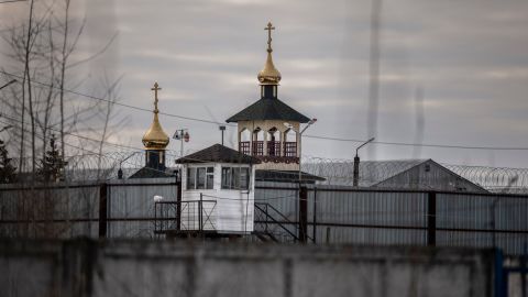 An Orthodox church is seen behind the barriers of Penal Colony No. 2.