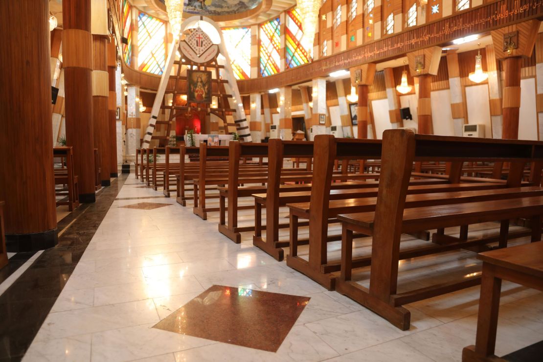 The dark red squares on the floor scattered throughout the Our Lady of Salvation church mark the places where people died as terrorists laid siege to the church. Pope Francis is set to meet with a small gathering at this church on Friday, the first day of his historic visit. 