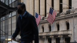 People walk by the New York Stock Exchange (NYSE) on Wall Street in New York on Feb. 25, 2021