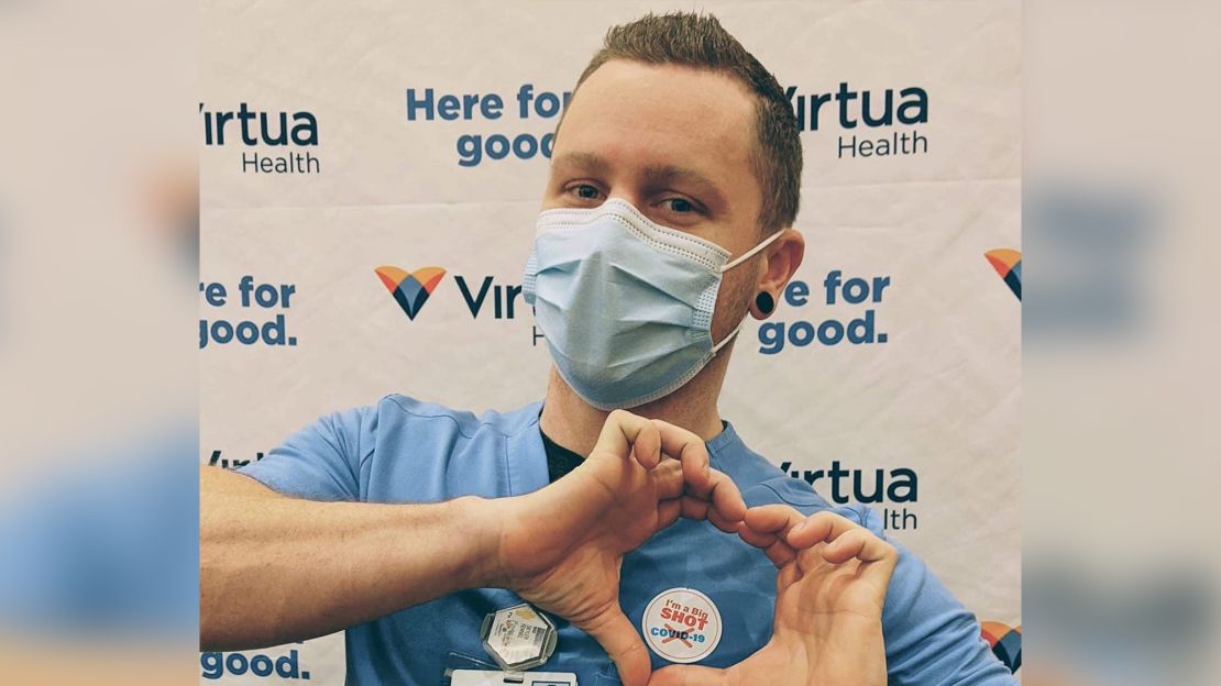 Skyler Fehnel, a radiologic technologist at Virtua Health, stopped for a photo after receiving the COVID-19 vaccine at Virtua's vaccine clinic for its employees in Voorhees, New Jersey. 