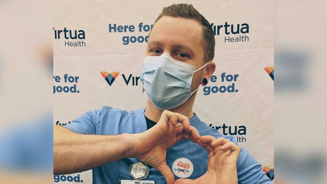 Skyler Fehnel, a radiologic technologist at Virtua Health, stopped for a photo after receiving the COVID-19 vaccine at Virtua's vaccine clinic for its employees in Voorhees, New Jersey. 