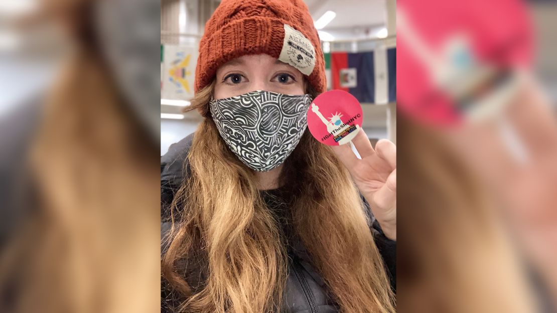 Kate Caudill, a volunteer at a vaccine site, said posting a selfie was important "to encourage others that I felt good and confident" after receiving a leftover dose at the end of a day. 