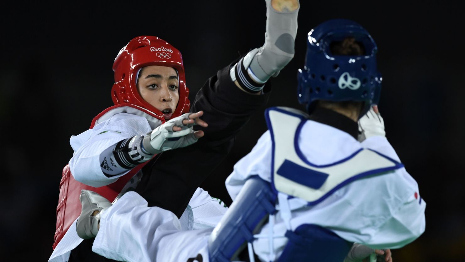 Kimia Alizadeh (L) competes with Croatia's Ana Zaninovic during their women's taekwondo qualifying bout in the -57kg category as part of the Rio 2016 Olympic Games, on August 18, 2016, at the Carioca Arena 3, in Rio de Janeiro. 