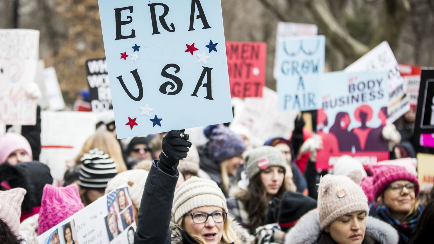 A marcher holds a sign that say "ERA USA" during the Woman's March in the borough of Manhattan in New York on January 18, 2020.