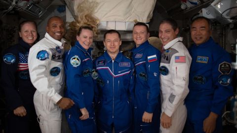 The seven-member Expedition 64 crew poses for a portrait inside the International Space Station. From left are, NASA astronauts Shannon Walker, Victor Glover and Kate Rubins; Roscosmos cosmonauts Sergey Ryzhikov and Sergey Kud-Sverchkov; NASA astronaut Michael Hopkins; and JAXA astronaut Soichi Noguchi. 