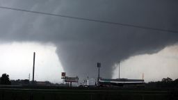 A tornado moves through Tuscaloosa, Ala. Wednesday, April 27, 2011. A wave of severe storms laced with tornadoes strafed the South on Wednesday, killing at least 16 people around the region and splintering buildings across swaths of an Alabama university town. (AP Photo/The Tuscaloosa News, Dusty Compton)