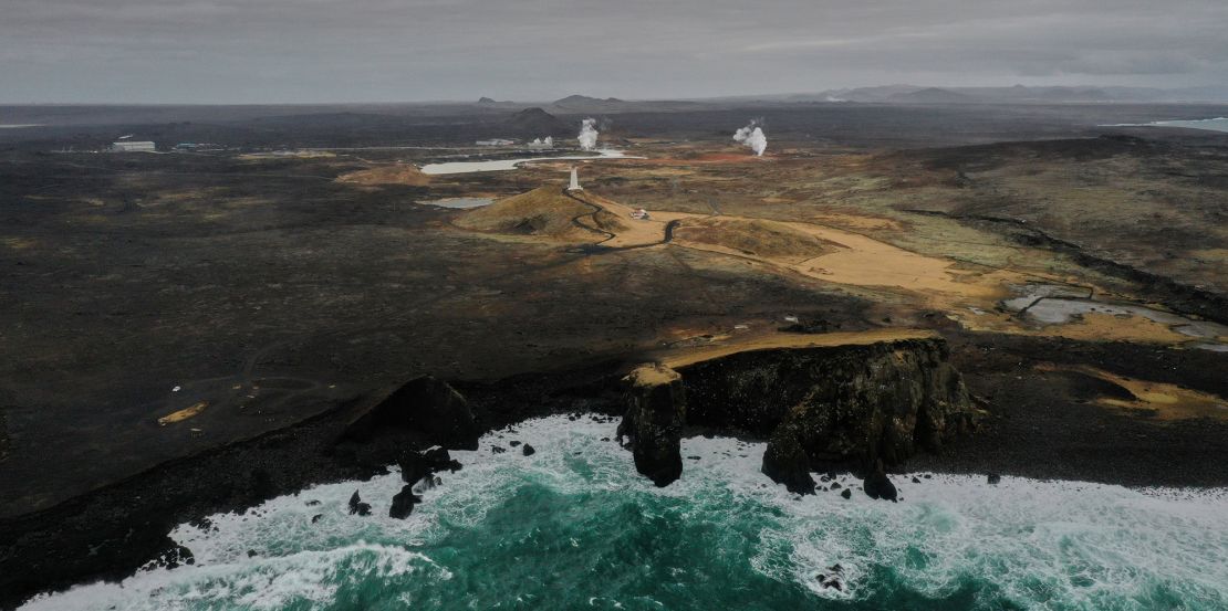 Aerial view taken on February 28, 2021 shows the lighthouse and the geothermal energy plant near the town of Grindavik on the Reykjanes peninsula, Iceland.