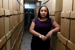 Fulton County District Attorney Fani Willis poses among boxes containing thousands of primal cases at her office, Wednesday, February 24, 2021, in Atlanta.