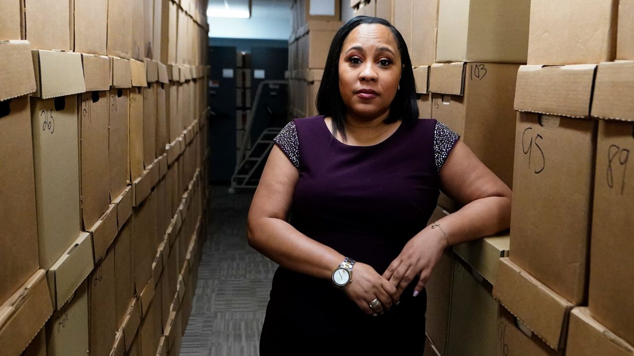 Fulton County District Attorney Fani Willis poses among boxes containing thousands of primal cases at her office, Wednesday, February 24, 2021, in Atlanta.