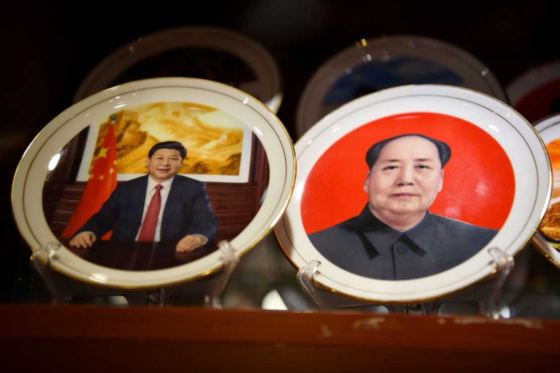 Souvenir plates featuring Chinese President Xi Jinping (L) and late communist leader Mao Zedong are seen at a store in Beijing on March 2,