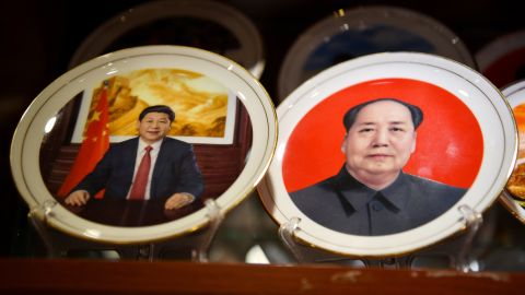 Souvenir plates featuring Chinese President Xi Jinping (L) and late communist leader Mao Zedong are seen at a store in Beijing on March 2,