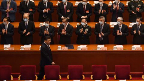 Delegates applaud as Chinese President Xi Jinping arrives for the opening ceremony of the Chinese People's Political Consultative Conference (CPPCC) at the Great Hall of the People in Beijing on March 4.