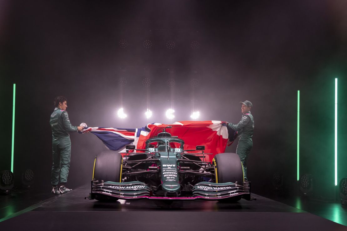 Lance Stroll and Sebastian Vettel unveil the new Aston Martin AMR21.