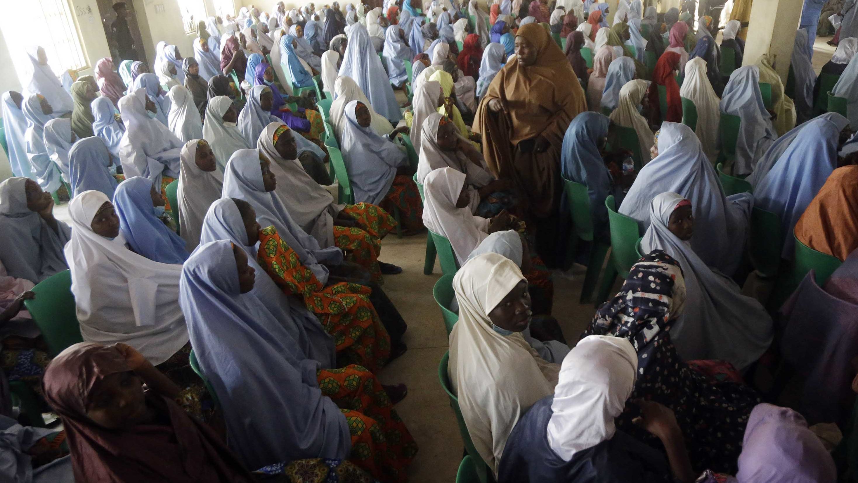 Freed school girls are seen during a reunion with their parents in Jangebe, Nigeria, on March 3.