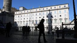 A pedestrian is silhouetted as she walks past Chigi palace in Rome, Italy, on Tuesday, Jan. 26, 2021. Italian Prime Minister Giuseppe Conte will resign on Tuesday morning to avoid a damaging defeat in the Senate and maneuver for a return at the head of a new government. Photographer: Alessia Pierdomenico/Bloomberg via Getty Images