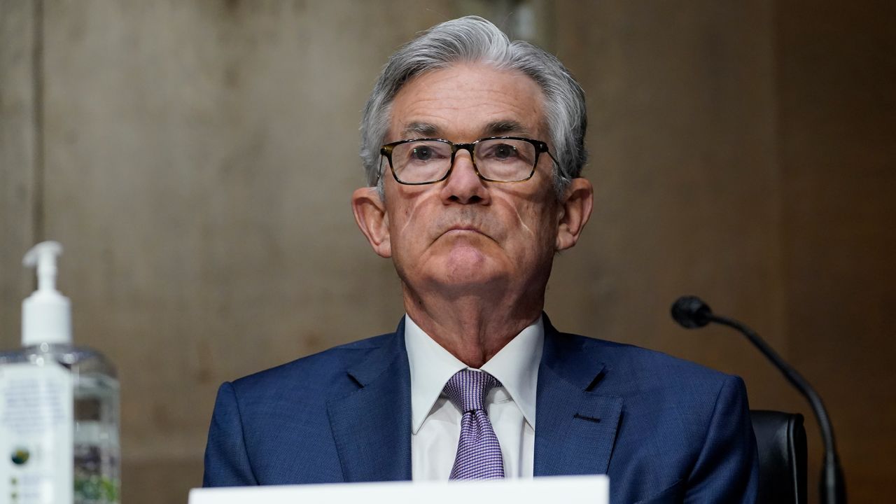 In this Dec. 1, 2020 file photo, Chairman of the Federal Reserve Jerome Powell appears before the Senate Banking Committee on Capitol Hill in Washington.  Powell told Congress on Wednesday, Feb. 24, 2021,  that the central bank will not begin raising interest rates until the Fed believes it has reached its goals on maximum employment  and warned that many people in the hardest hit industries will likely need to find different jobs.  (AP Photo/Susan Walsh, Pool, File)