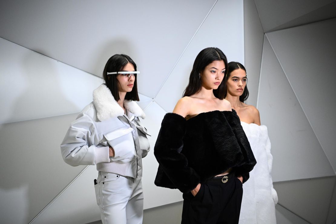 Models pose backstage prior to the show.