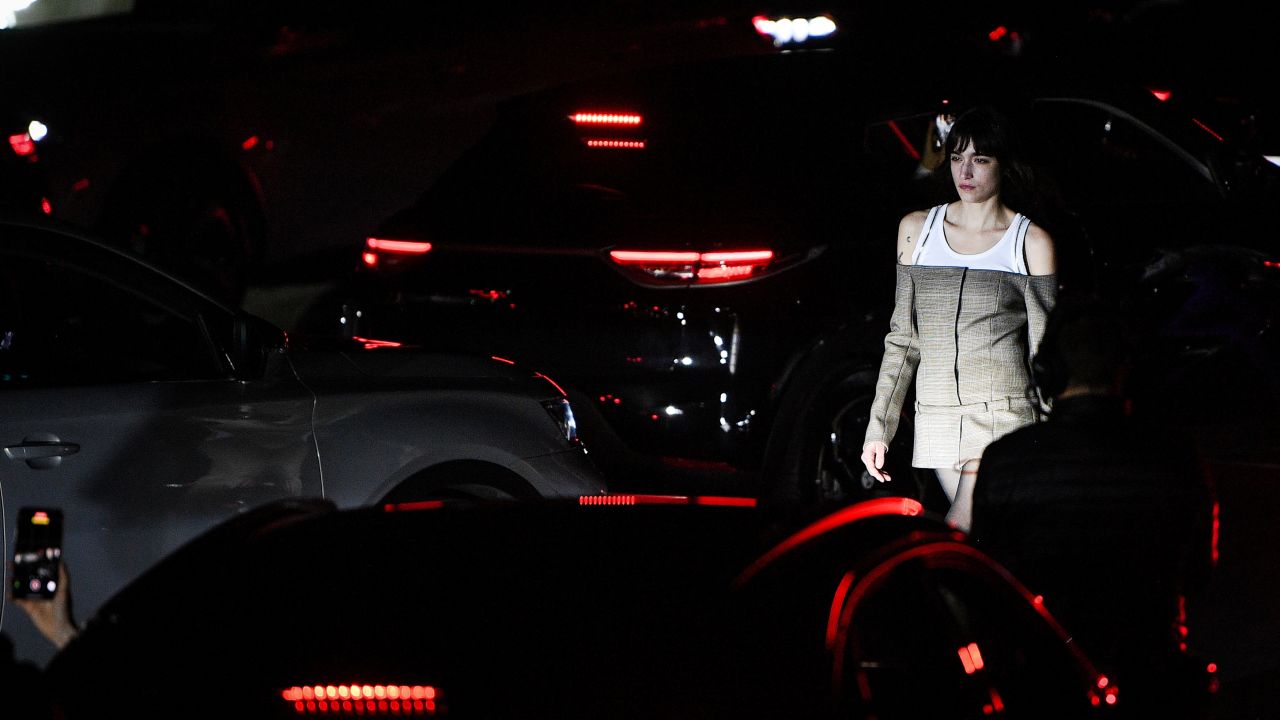 A model presents a creation for Coperni AW21 Women's Fall-Winter 2020-2021 Ready-to-Wear collection fashion show at Bercy Arena in Paris, on March 4, 2021. - Attendees watch the runway from electric cars during a 'drive-in' catwalk organised by the brand. (Photo by Anne-Christine POUJOULAT / AFP) (Photo by ANNE-CHRISTINE POUJOULAT/AFP via Getty Images)