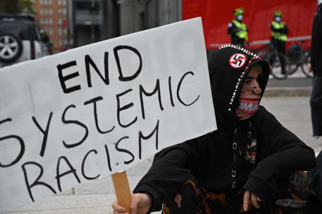 Protesters gather during a demonstration in central Montreal on October 3, 2020, to demand action for the death of Joyce Echaquan, a Canadian indigenous woman subjected to live-streamed racist slurs by hospital staff before her death.