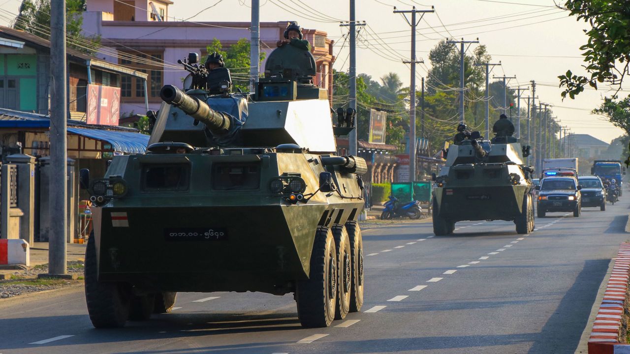 Soldiers ride in military armoured vehicles in Myitkyina, Kachin state on February 3,.