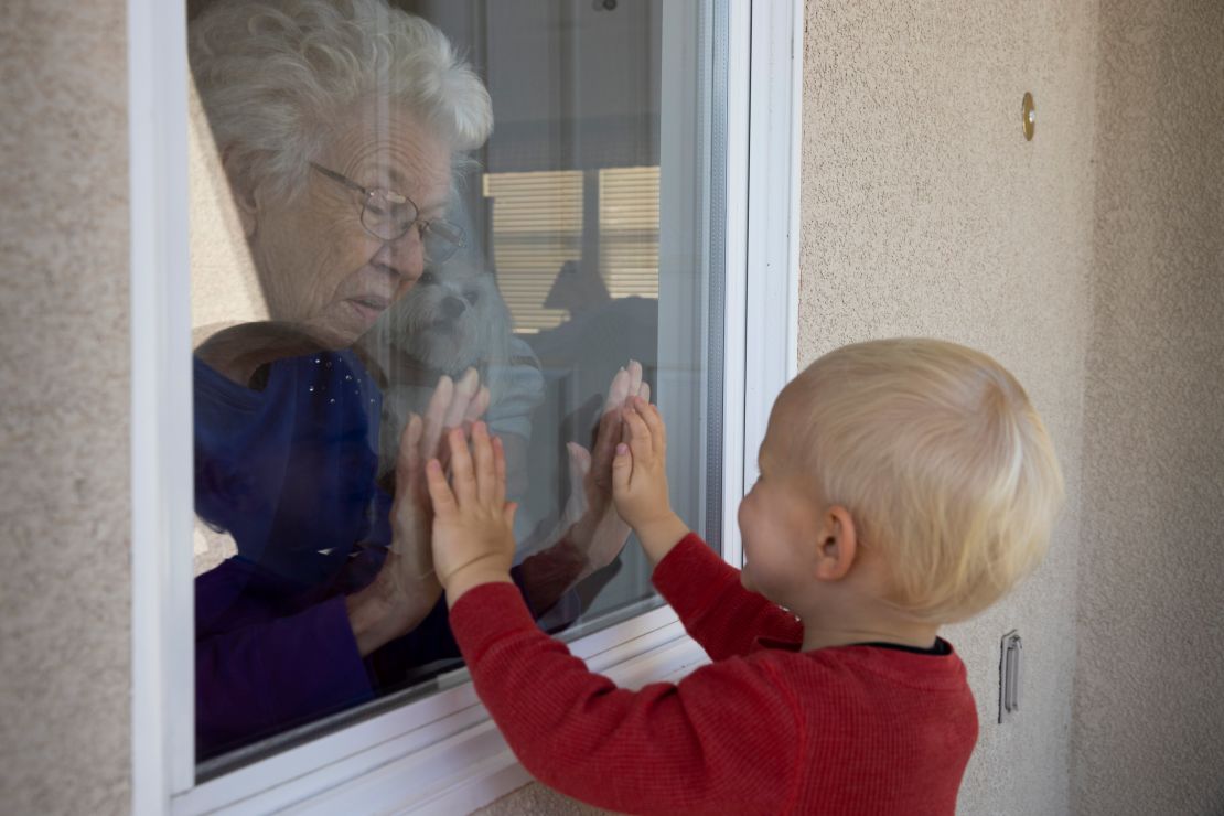 Axel Stirton, 2, visits his neighbors in Ventura, California, on April 3, 2020. 