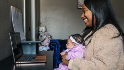 LOS ANGELES, CA - NOVEMBER 26: Alexis Small and her newborn baby Aubrielle Kitchen meet with family over a Zoom Conference call on November 26, 2020 in Los Angeles, California. Families have adjusted plans under CDC guidelines. Due to the spike in COVID-19 cases, as of November 21, 2020, the state of California has required that all non-essential work and activities stop between 10PM and 5AM in counties across the state. (Photo by Brandon Bell/Getty Images)