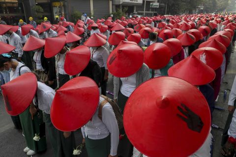 Schoolteachers wear traditional hats while participating in an anti-coup demonstration in Mandalay on March 3.