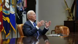 US President Joe Biden gestures as he speaks during a virtual call to congratulate the NASA JPL Perseverance team on the successful Mars landing, in the Roosevelt Room of the White House in Washington, DC on March 4, 2021. 