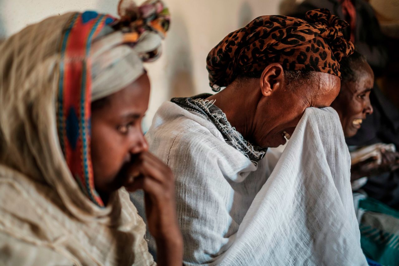 People mourn together in Dengolat, Ethiopia, on Friday, February 26. A CNN investigation published that day <a href="https://www.cnn.com/2021/02/26/africa/ethiopia-tigray-dengelat-massacre-intl/index.html" target="_blank">revealed a massacre</a> that took place in Dengelat late last year. Eyewitnesses told CNN that a group of Eritrean soldiers opened fire at church while Mass was underway, claiming the lives of priests and entire families. The UN's high commissioner for human rights <a href="https://www.cnn.com/2021/03/04/europe/ethiopia-tigray-un-independent-probe-war-crimes-intl/index.html" target="_blank">has called for an independent investigation.</a> Eritrea's government has yet to respond to CNN's request for comment.
