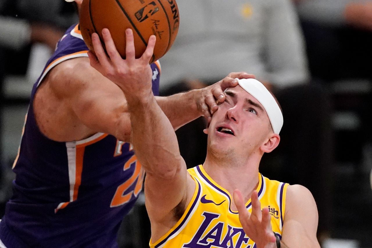 Los Angeles Lakers guard Alex Caruso is hit in the face by Phoenix's Dario Saric during an NBA game in Los Angeles on Tuesday, March 2.