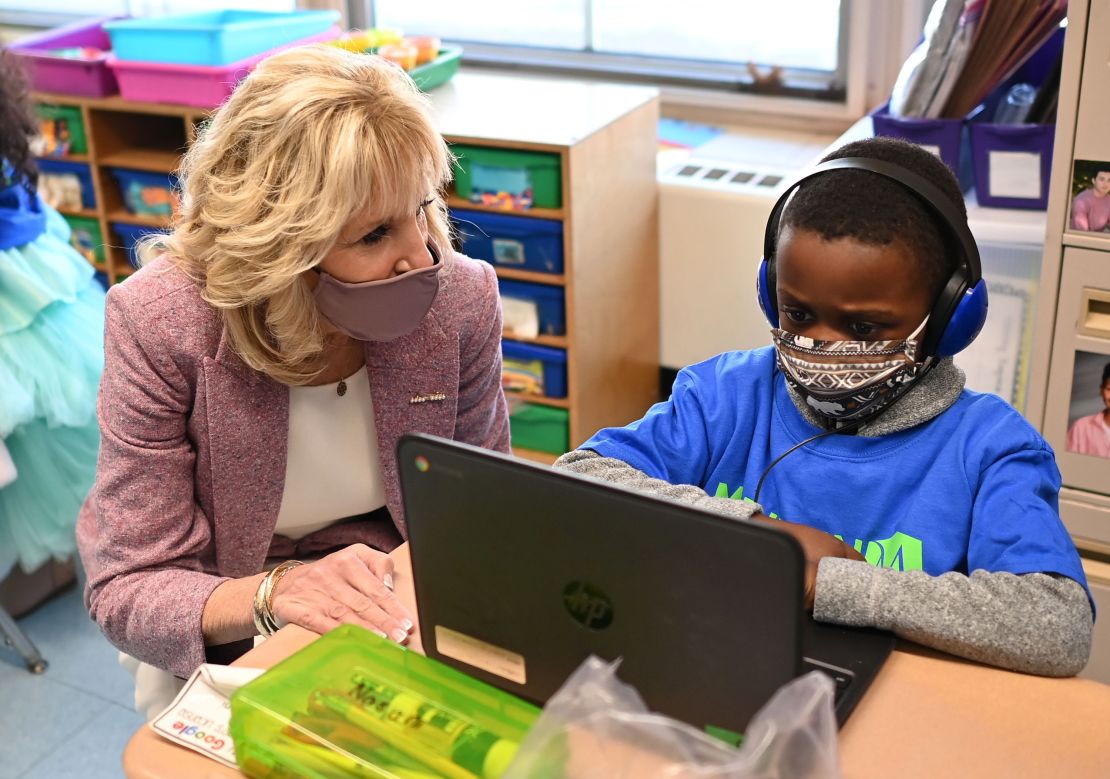 US First Lady Jill Biden speaks with a student as she tours Benjamin Franklin Elementary School in Meriden, Connecticut, on March 3, 2021.