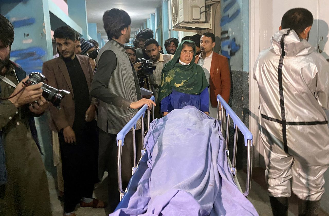 People move the body of a woman who was killed by gunmen in Jalalabad, Afghanistan, on Tuesday, March 2. <a href="https://www.cnn.com/2021/03/02/middleeast/afghanistan-media-worker-killed-intl-hnk/index.html" target="_blank">Three female media workers were fatally shot in Jalalabad,</a> government officials said, amid a wave of killings that is spreading fear among professional workers in urban centers. Government sources said the women were killed on their way home from work.