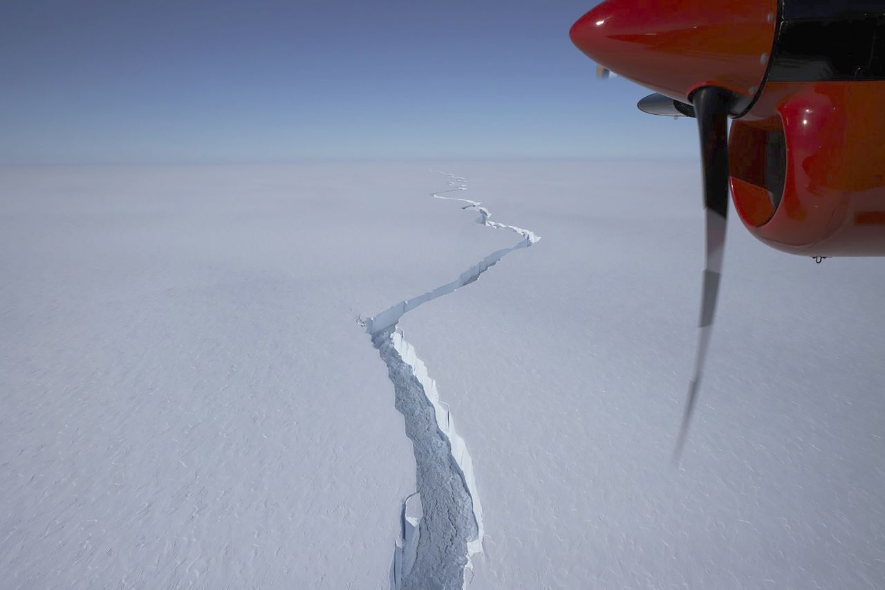 An airplane flies over the North Rift crack of Antarctica's Brunt Ice Shelf in this January photo released on Friday, February 26. <a href="https://www.cnn.com/2021/02/27/world/antarctica-iceberg-trnd/index.html" target="_blank">A giant iceberg bigger than New York City</a> just broke off the Brunt Ice Shelf.