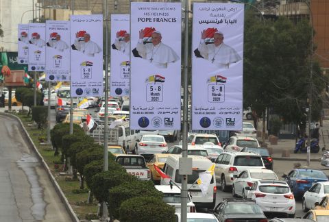 Posters in Baghdad are set up for Pope Francis on Thursday.