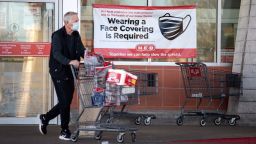 AUSTIN, TX - MARCH 03: A customer leaves H-E-B on March 3, 2021 in Austin, Texas. The popular Texas supermarket chain will not require customers to wear masks when the statewide mask mandate ends on March 10, 2021. (Photo by Montinique Monroe/Getty Images)