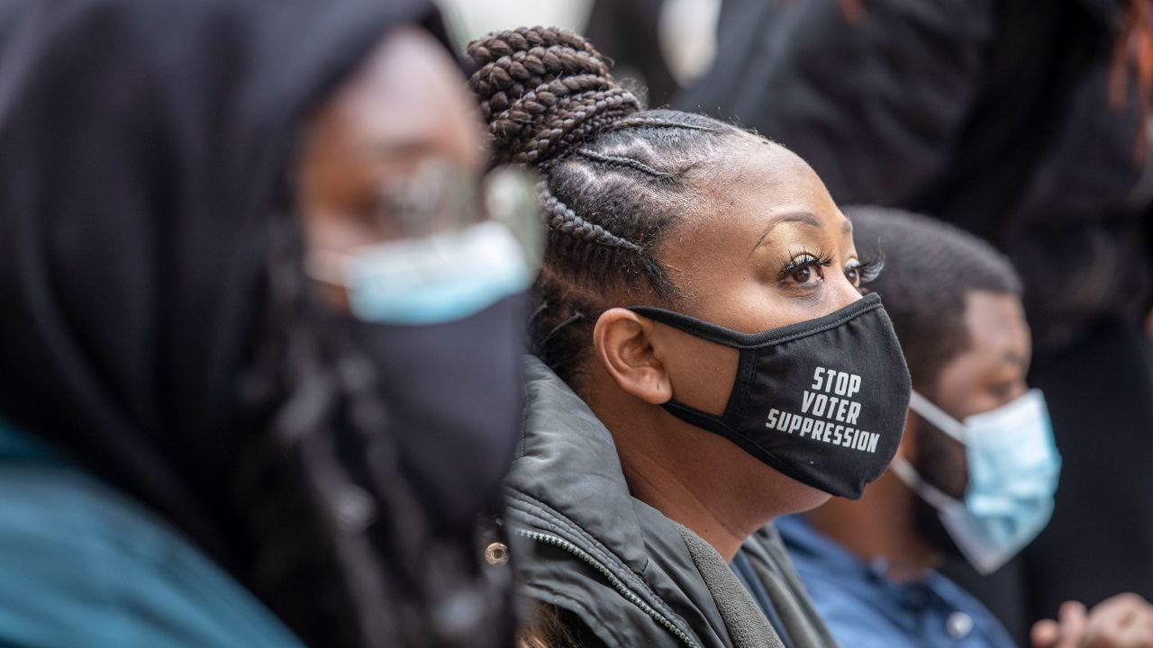 Demonstrators chained together protest HB 531 outside of the Georgia State Capitol Building on day 25 of the legislative session in Atlanta, Monday, March 1, 2021. (Alyssa Pointer/Atlanta Journal-Constitution via AP)