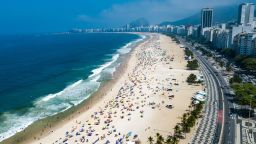 RIO DE JANEIRO, BRAZIL - SEPTEMBER 06: An aerial view of  people enjoying the weather at Copacabana Beach on September 6, 2020 in Rio de Janeiro, Brazil. Residents of Rio de Janeiro and tourists disrespected the rules of the city and occupied the sands of the beaches. A municipal decree cleared beach vendors and permitted bathing in the sea. However, the use of chairs and tents on the sand is still prohibited. (Photo by Buda Mendes/Getty Images)