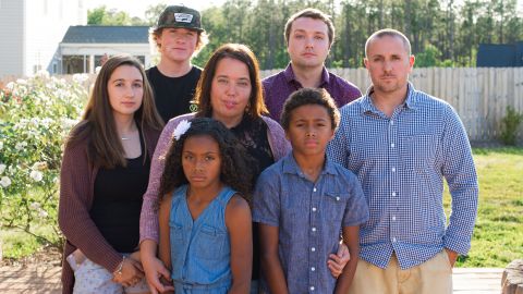 Mary Kita, center, and Timothy Kita, right, are fearful when their children, who they asked not be named, leave the house. Jordan Kita stands between his parents. The missing girl is not pictured.