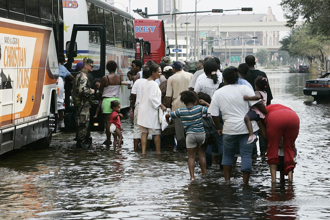 Evacuees board buses in New Orleans on September 1, 2005, after Hurricane Katrina hit. Years later, the devastation continues, according to Lori Peek, director of the Natural Hazards Center. "Following low-income African American kids...today, that storm is not over in their life," she says.