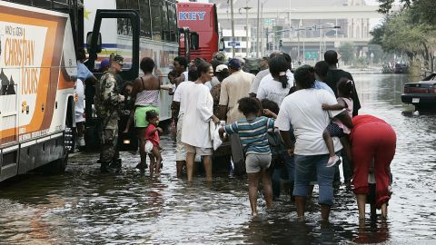 Evacuees board buses in New Orleans on September 1, 2005, after Hurricane Katrina hit. Years later, the devastation continues, according to Lori Peek, director of the Natural Hazards Center. "Following low-income African American kids...today, that storm is not over in their life," she says.