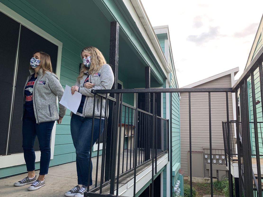 Teachers Emily Countryman and Brandee Brandt stop by a disengaged student's home.
