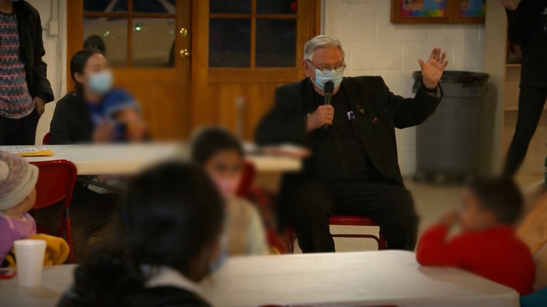 Father Roy Snipes addresses migrants at the Our Lady of Guadalupe church in Mission, Texas.