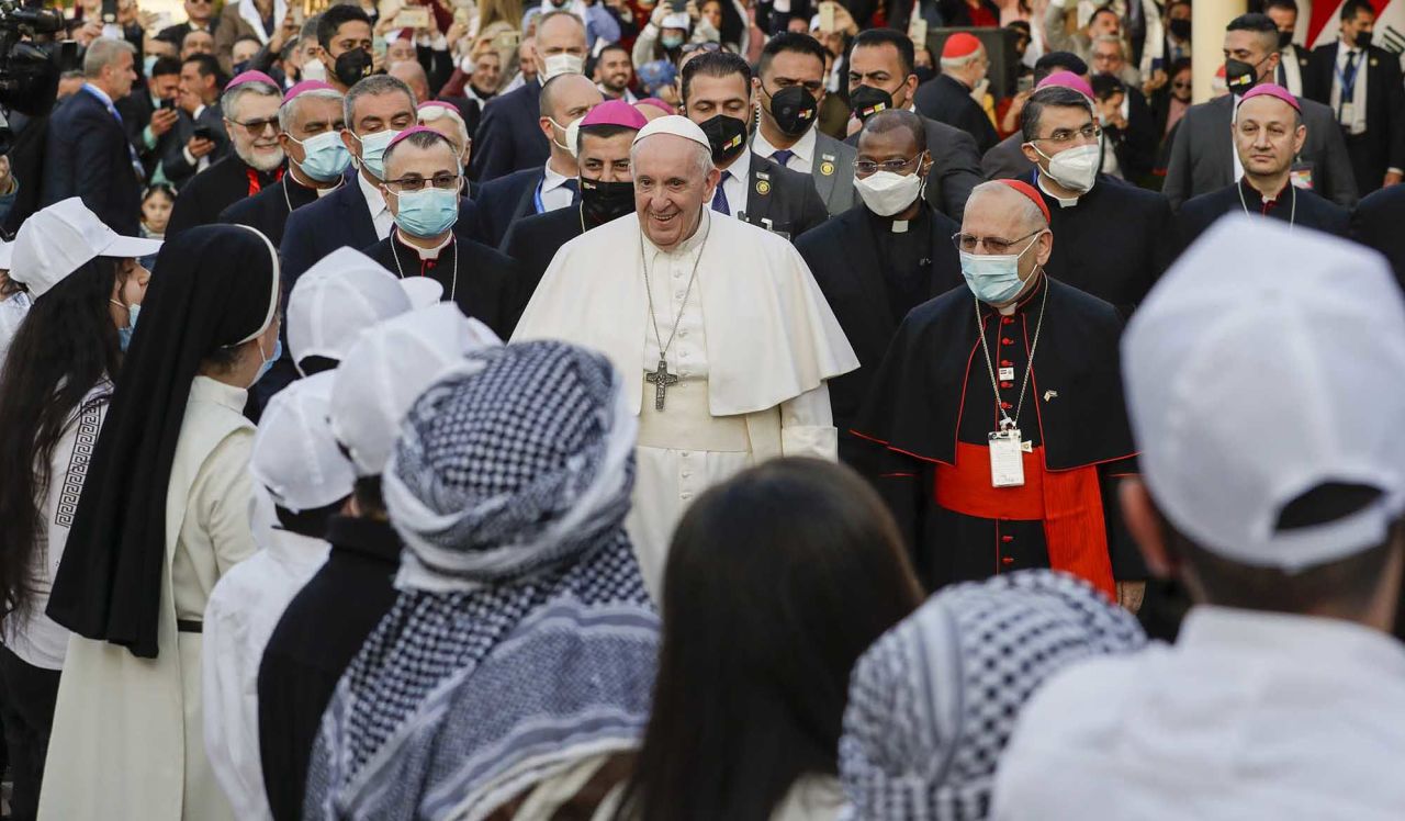 Francis arrives to officiate Mass with other priests in Baghdad, Iraq, on Saturday.